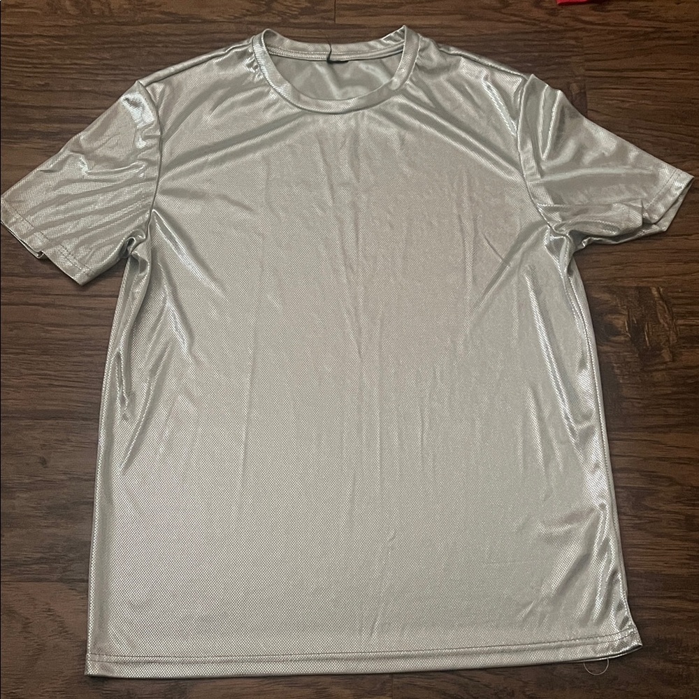 Teenager Silver T-Shirt size approximately (10-12) great condition, 100% polyest